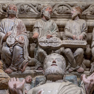 Christ in Majesty and elderly musicians, the organistrum